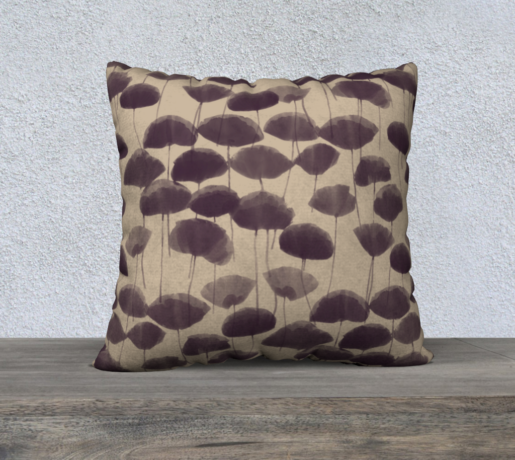 Decorative pillow with brown abstract pattern on a wooden surface and light gray background