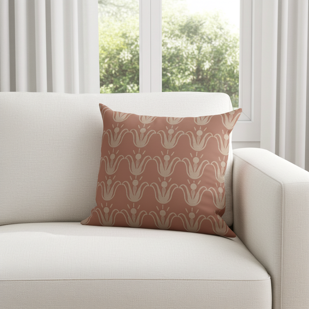 Patterned pillow on a white sofa with a window in the background