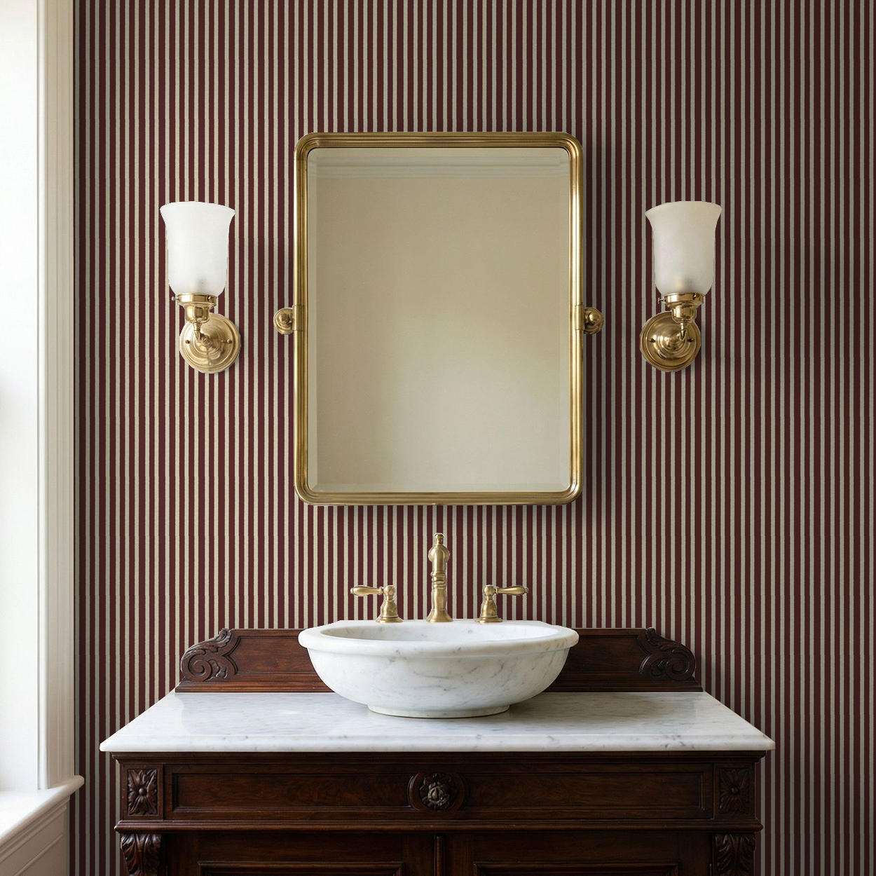 Maroon striped wallpaper in elegant bathroom with brass fixtures and mirror.