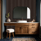 Maroon striped wallpaper in a modern bathroom with wooden vanity and mirror.