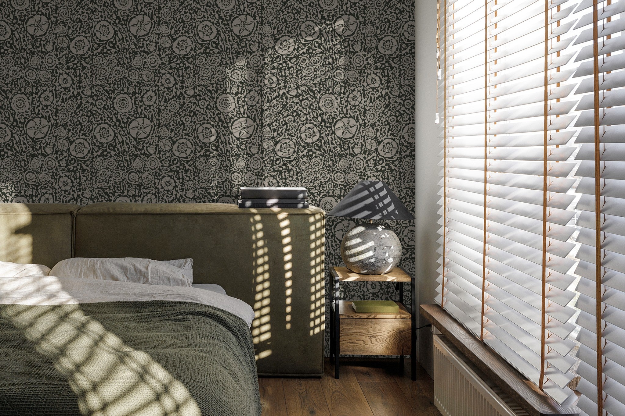 Suzani floral green wallpaper in a cozy bedroom with natural light and blinds.